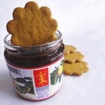 gingersnap cookie dipped into an open jar of Asian Pear spread